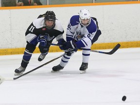 Lyndon Shanks, left, of the Nickel City Sons (team 2), and Philip Morrone, of the Markham Waxers, battle for the puck during bantam action at the Big Nickel Hockey Tournament at the Gerry McCrory Countryside Sports Complex in Sudbury, Ont. on Friday November 6, 2015. Waxers won 1-0. John Lappa/Sudbury Star/Postmedia Network