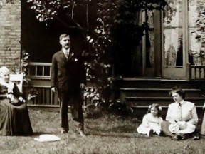 R. McCormick photo
People stand before a former home in a photo donated recently to the Gleaners Food Bank yard sale in Belleville. Gleaners' director Susanne Quinlan wants to reunite it with descendants of those pictured. It was likely taken in the late 1800s or early 1900s in Belleville's east end; the home has apparently been demolished.