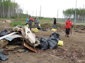 Community volunteers take part in the last Tower Road Clean-up held in 2015. The Fort McMurray Environment Committee is hoping to bring back its environment initiatives to the region. Supplied image/ Dawn Booth, FMEC