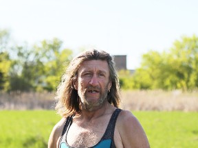 Meghan Balogh/The Whig-Standard
John Clark stands in a field outside of his campsite. Clark has been homeless since October 2017 and is one of many who live in a forested area in Napanee.