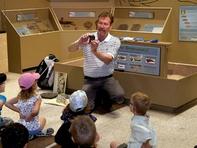 Ian MacAlpine/The Whig-Standard
Mark Badham, curator of the Miller Museum of Geology at Queen’s University, leads his popular dinosaur class for kindergarten students at the museum on Monday. Badham is retiring at the end of June.