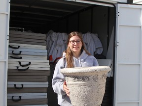 Kimberly Caron, an Urban Park coordinator, pulls out a flower pot from one of the storage units where the Downtown Timmins Business Improvement Association has materials to set up for the Urban Park. This year, the Urban Park is kicking off with a five-day start-up during the week of Stars and Thunder in order to provide some free family events for those in the downtown area during the festival.