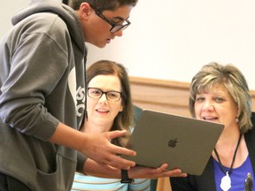 Shail Giroux, a Grade 8 student at Korah Intermediate, shares details about his GPS guided autonomous transport system with Algoma District School Board chair Jennifer Sarlo and director of education Lucia Reece during a meeting of trustees on Tuesday night. Giroux's project won best in fair at the 31st annual Rotary Science Fair Algoma in April. He advanced to Canada Wide Science Fair in Ottawa in May where he won a gold medal, an entrance scholarship to Western University and S.M. Blair Family Foundation Award. Vera Antunes and Brooke Donnelly, from Anna McCrea, placed second in the junior division at Rotary Science Fair Algoma. They won a bronze medal and entrance scholarship to Western University for their project, Let It Snow, at the national event. Julie Delorme and Raili Kary, from St. Mary's College, earned an honorable mention in Ottawa for The Effect of Different Acer Species on Adult Asian Longhorned Beetles.