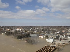 A view of the flooding from the Boardwalk apartment building in downtown Chatham, Sunday, Feb. 25. Floodwaters damaged properties in Chatham and Thamesville. As of May 31, 16 residents from the two communities had applied to the Ontario government for disaster recovery assistance because of flooding. Dax Melmer/Windsor Star/Postmedia Network