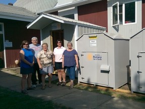 Accepting the bins and shed for New to You are Crossroads’ Executive Director, Wendy Biegel, Crossroads’ Chairperson Darcy Moss, and Crossroads’ board Member in charge of New to You, Chrissy Heck, on the far right. In the centre,  representing Rotary are Pauline Broddle and Shilo Wild.