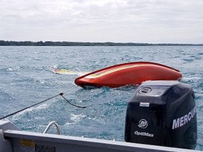Huron OPP Marine Unit and the Canadian Coast Guard came to the aid of a capsized sailboat and three people on board on June 10, 2018. (Shared photo)