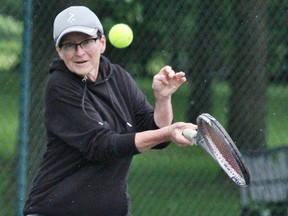 Sandie Ennett returns a shot during the 49th annual regional doubles tennis tournament this past weekend in Stratford. (Cory Smith/The Beacon Herald)