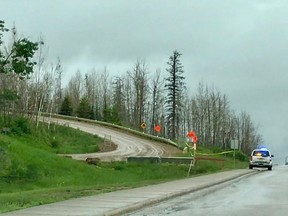 A Wood Buffalo RCMP vehicle guards the Abasand access road on Wednesday, June 13, 2018. Vincent McDermott/Fort McMurray Today/Postmedia Network