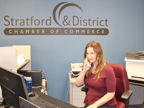 Jennifer Smith answers the phone at the Stratford and District Chamber of Commerce on Wednesday, June 13, 2018 in Stratford, Ont. (Terry Bridge/Stratford Beacon Herald)