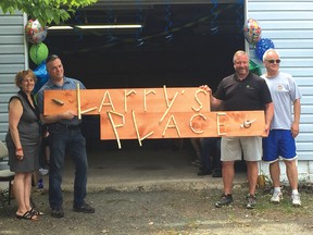 Photo by JESSICA BROUSSEAU/FOR THE STANDARD
Derek Duhaime created the Larry’s Place sign that will be mounted at the new shelter for displaced men. He is joined by MPP Michael Mantha, MP Carol Hughes and Councillor Luc Cyr at the grand opening of Larry’s Place on June 9.