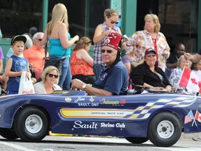 Taking a spin at 94th annual Rotary Community Day Parade in July 2015.