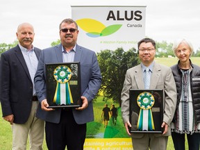 Two men were recognized last week for advancing the objectives of the Alternative Land Use Services (ALUS) program in Canada. They are Joe Csoff of Delhi, second from left, and Dr. Wanhong Yang, second from right, a geography professor at the University of Guelph. On hand for the event, which was held in Tillsonburg, were Bryan Gilvesy, left, CEO of ALUS Canada, and Camilla Dalglish, right, director of the W. Garfield Weston Foundation.  Contributed photo