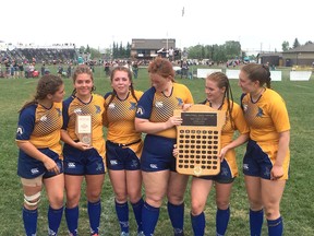 The seven-time Metro League champion Bev Facey Falcons senior girls rugby team captains pose with the consolation trophy at the recent provincials in Calgary. Photo Supplied