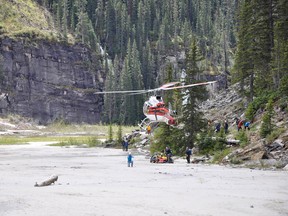 A climber in critical condition is rescued from the Lake Louise area Tuesday afternoon. The  person was injured after a high winds toppled a tree and it fell 80-100 metres on a group of three climbers. The medical team stabilized the climber for approximately 20 minutes before STARS air ambulance lifted them out of the area to Calgary. Photo courtesy of Ray Charest.