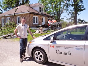 Mitch Meredith, a severe weather meteorologist with Environment Canada in Toronto, was in Haldimand County Thursday inspecting damage from Wednesday’s violent thunderstorm. This was the aftermath at a home at 1600 Highway 3 south of Townsend.  MONTE SONNENBERG / SIMCOE REFORMER