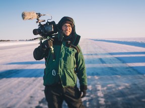 Photo by Laura Beauchamp
Filmmaker Chris Beauchamp stands on the ice road outside of Yellowknife while filming kite skiers in 2018.