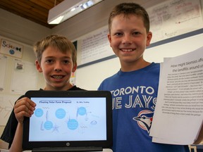 Zorra Highland Park Public School students Riley Vording and Camden Munro tackle the local issue of a proposed dump in Beachville using science and electricity. (Chris Funston/Sentinel-Review)