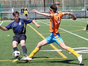 Gage Robson, left, of Bishop Carter Gators, and Joe Deni, of Lasalle Lancers, battle for the ball during soccer action at the boys division II final at the James Jerome Sports Complex in Sudbury, Ont. on Thursday June 14, 2018. Lasalle won 2-0. Meanwhile, l'Horizon defeated St. Benedict 2-0 in the girls division II final. John Lappa/Sudbury Star/Postmedia Network