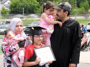 Youssef Al Masri (right) and his family after the graduation ceremony at Seven Generations Education Institute in Kenora on Wednesday, June 13. 
RYAN STELTER/DAILY MINER AND NEWS