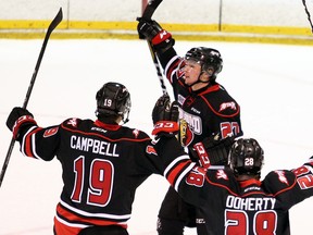 Aidan Dudas celebrates a goal with teammates Chase Campbell and Jackson Doherty during a game in early 2018 at the Bayshore. Dudas, who is expected to be taken in the National Hockey League's Entry Draft this summer, will be a key player for the Attack  in 2018-19. Greg Cowan/The Sun Times.