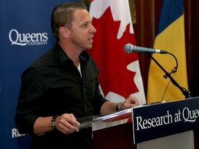 Grant recipient Sam McKegney speaks at Queen's University in Kingston on Friday after it was announced that he and 23 other Queen's researchers will receive grants from the federal government of more than $3 million to conduct research to advance understanding in peoples and societies. McKegney and his group of researchers are looking into Indigenous peoplesÕ relationships with hockey in Canada. (Ian MacAlpine/The Whig-Standard)