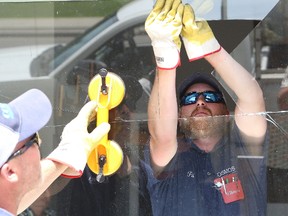 John Lappa/Sudbury Star

Scott Therrien, left, and his work partner, Pat Ouellette, of Cosmos Glass Corp., remove the first of two windows at Damascus Cafe & Bakery on Beech Street in Sudbury on Friday. The windows, which were damaged by pellets from an Airsoft gun in late May, are being replaced thanks to some members from Downtown Sudbury Business Improvement Area. Dennis Gainer, who owns Peddler's Pub on Cedar Street, worked with the downtown BIA to organize a fundraising drive to repair the windows at the bakery. The fundraising effort was so successful that some of the members of the downtown BIA were on hand to present an additional monetary donation to bakery owner Hussein Qarqouz and his family on Friday. Qarqouz plans to use the money for upgrades at his business.