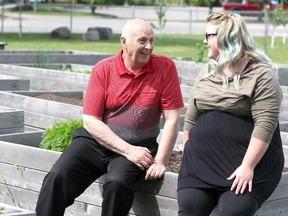 Mike Delfre and Jessica Laidley, of United Way of Sault Ste. Marie and Algoma District, talk at a community garden at the former Etienne Brule Public School.