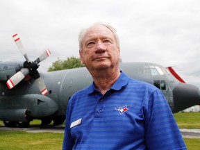 Chris Colton, the soon-to-be-retired director of the National Air Force Museum of Canada, stands before a CC-130 Hercules in the museum's air park. The former Hercules pilot said he's enjoyed his "wonderful career" with the facility.