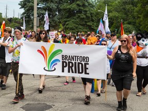 Members of the LGBTQ community and their supporters walk into Mohawk Park on Saturday as they take part in the eighth annual Pride Walk. 
ALEX VIALETTE/THE EXPOSITOR