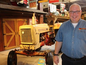 Rob Adlam, a member of the International Cockshutt Club and the coordinator of a new Cockshutt exhibit in Waterford, stands by the exhibit's highlight, a 1958 prototype Cockshutt 550 tractor.
Susan Gamble/The Expositor