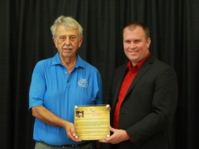 Archie Berube, a volunteer with the Hollinger Golf Club and the McIntyre Curling Club for more than four decades, left, poses with Mayor Steve Black at the J.P Bickell Auditorium during the fifth annual Sports Hall of Fame on Saturday.