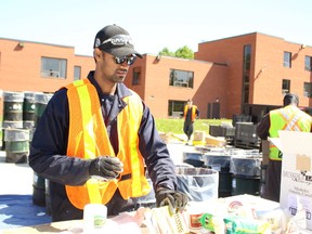 Biyash Murugesa organizes contains at the hazardous waste on Saturday, June 16.