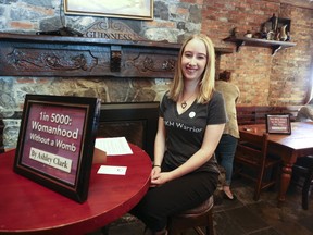 Ashley Clark is the organizer of Human Bookshelf, as well as one of the “books” that people could sit down with during the event at the Tir Nan Og on Saturday. (Meghan Balogh/The Whig-Standard/Postmedia Network)