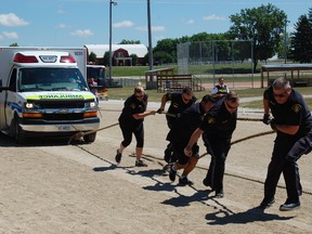 Paramedics, police officers, firefighters, and high school students battled it out to pull emergency service vehicles across the finish line before their competitors.