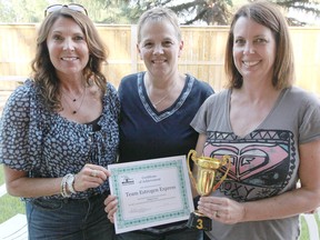 KASSIDY CHRISTENSEN HIGH RIVER TIMES/POSTMEDIA NETWORK. Photographed from left to right are third place winners Estrogen Express team members Lea Sorkilmo, Brenda McCredie and Dawn Bleackley. Their fourth team member Carol Macleod was not present.