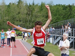 Callum Bruser, of Track North, competes in the boys long jump event at the Royal Canadian Legion District H track and field meet at the track at Laurentian University in Sudbury, Ont. on Saturday June 16, 2018. John Lappa/Sudbury Star/Postmedia Network