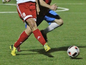 Stratford City FC's Nick Preikschas makes a pass against IST Serbia Friday night at Cowan Field. Stratford won 6-5. (Cory Smith/The Beacon Herald)