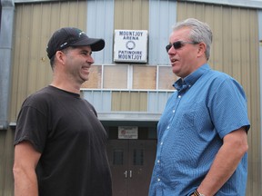 Rock Whissell, president of the Porcupine District Agricultural Society, left, chats with Timmins Coun. Rick Dubeau outside the Mountjoy Arena Monday morning. Dubeau asked for and received city council's support of a plan that would see the Saturday morning farmers' market in Mountjoy resume under the auspices of the agricultural society.