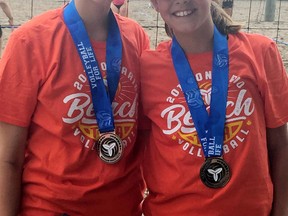 Lauryn Lahey, left, and Kenzie Lahey of Chatham, Ont., won silver in the 13U girls' premier division at an OVA beach tournament in Windsor, Ont., on Saturday, June 16, 2018. (Contributed Photo)