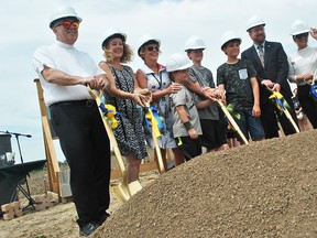 Father Jim Higgins, St. Clair Catholic District School Board vice-chair Michelle Parks, director of education Deb Crawford, student James Pearson from St. Agnes Catholic School, Brody VanRoboys from St. Vincent Catholic School, Brysen Anderson from Our Lady of Fatima Catholic School, Chatham-Kent Coun. Trevor Thompson and Nicole da Silva, special assistant to Chatham-Kent-Leamington MPP Rick Nicholls, get ready to break ground for a new north Chatham elementary school at 801 McNaughton Ave. W. on Monday. Tom Morrison/Chatham This Week