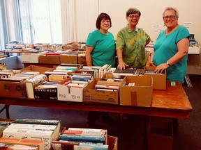 Friends of the Library members Donna Brown (left), Joan Barton and Sue Hoffman, of South Bruce Peninsula, sorted books before the Wiarton branch library's annual Canada Day book sale at the library in Wiarton, July 28. Submitted photo