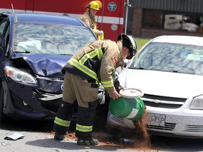 Firefighters respond to a two-vehicle crash at Great Northern Road and Second Line East on Tuesday afternoon.