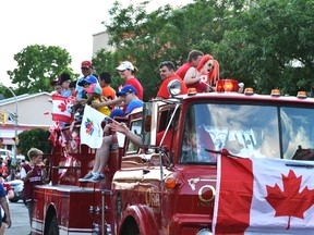 A fire truck decorated for Canada Day drives down the street during last year’s celebration in Stratford. The 2018 version, set for July 1 in Market Square, will feature a street theatre theme. (Stratford Beacon Herald file photo)