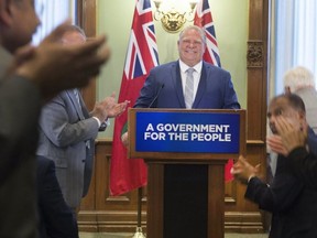Premier-designate Doug Ford addresses his caucus and the media at Queen's Park in Toronto, Ont. on Tuesday June 19, 2018. Stan Behal / Postmedia Network