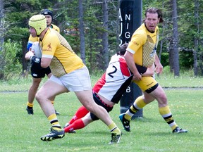 Banff Bears player-coach Mark Hooper carries the ball during a Calgary Rugby Union Div. 3 game against the Calgary Knights at the Banff Recreation Grounds on Saturday.