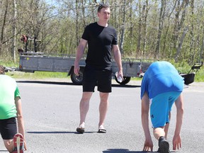 Brock McGillis runs fitness camp members through a drill in Sudbury, Ont. on Tuesday June 19, 2018. Gino Donato/Sudbury Star/Postmedia Network