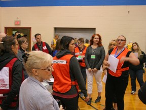 Faro Taug briefs volunteers taking part in the emergency management training exercise June 14 at the EE Oliver gym.