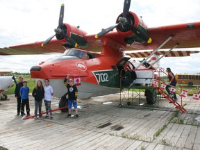 Enjoying their tour of the Canso aircraft at the Fairview Airport on June 15, Grade 5 E.E. Oliver students Benjamin Coghill, Parker Burns, Shayla Jordan, Shyanne Jensen and Carter Zavisha.