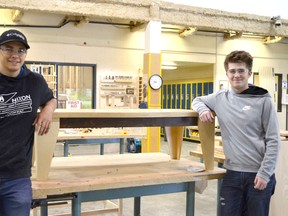 Bev Facey High School students show off their work in building furniture to replace aging items at other Elk Island Public Schools.

Photo Supplied