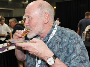 Doug Wey takes a bite of the Mercer Hall entry in the Taste the Best competition at the Ontario Pork Congress on Wednesday, June 20, 2018 in Stratford, Ont. (Terry Bridge/Stratford Beacon Herald)